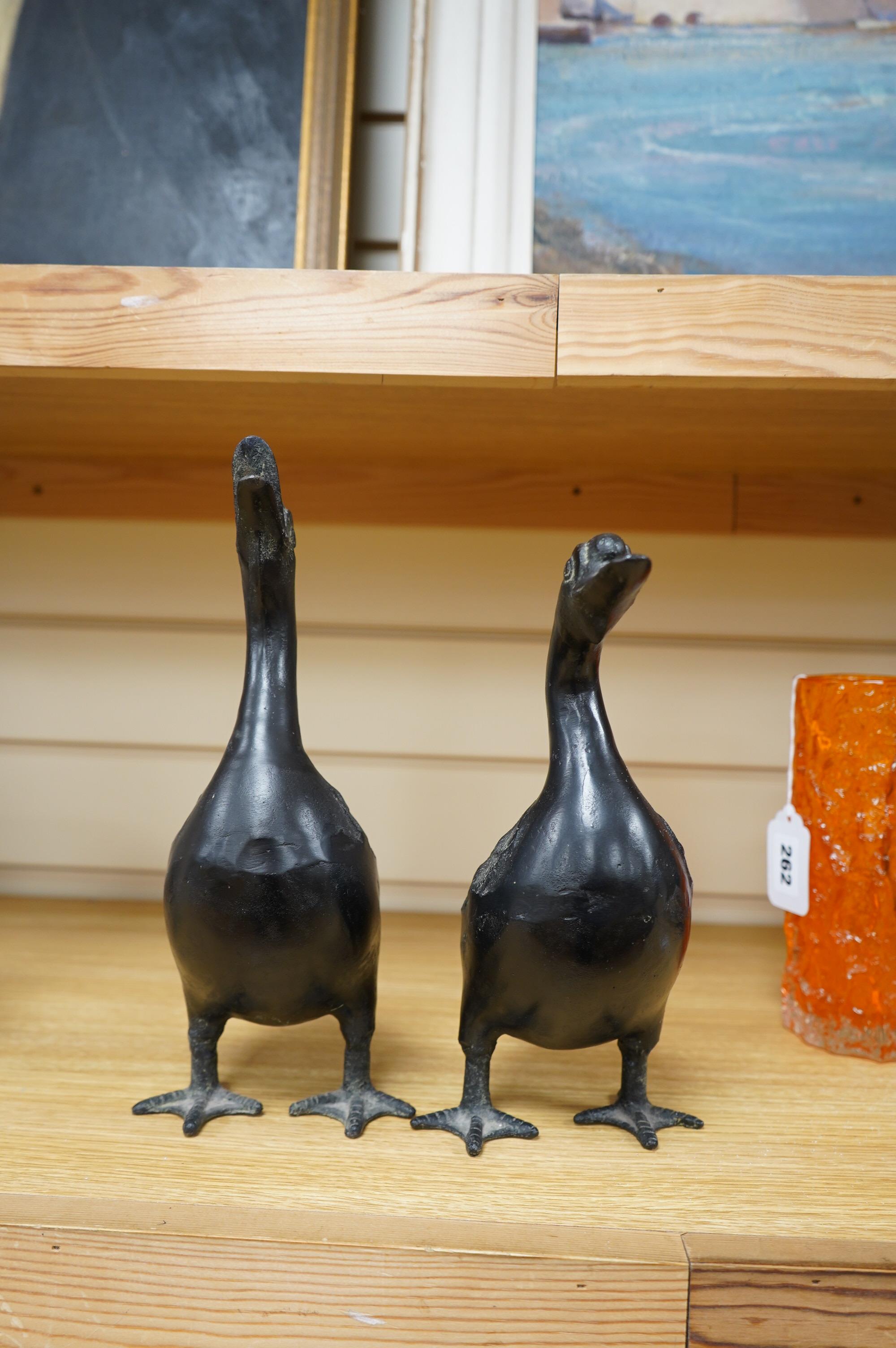 Two 20th century Japanese cast iron models of ducks, 28.5cm. Condition - fair to good